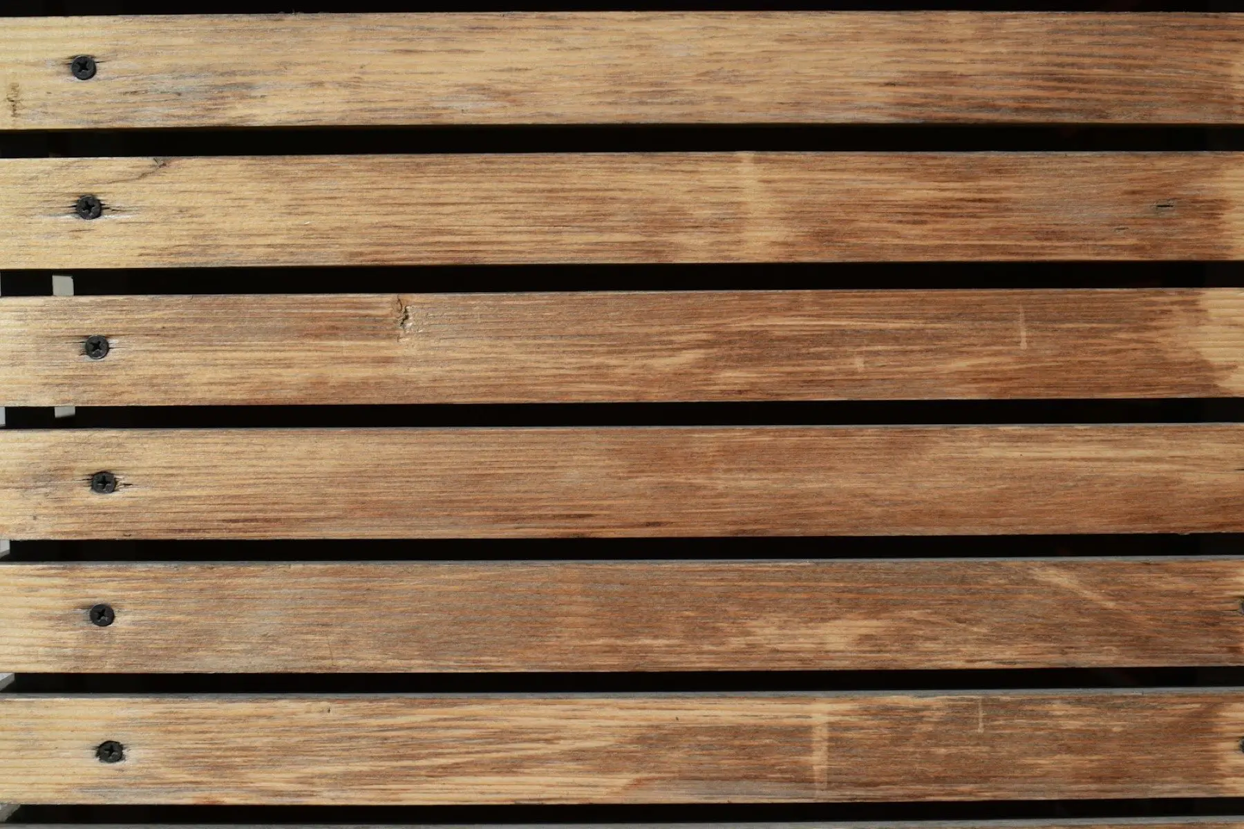 Close-up of weathered horizontal fence boards